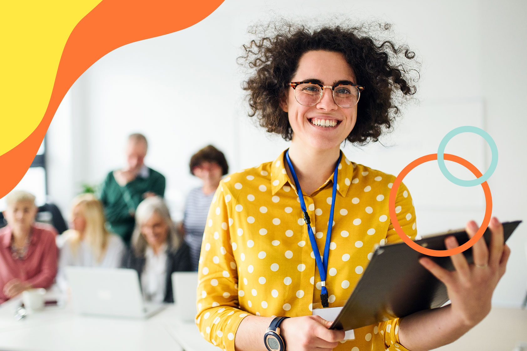 Female employee with laptop smiling
