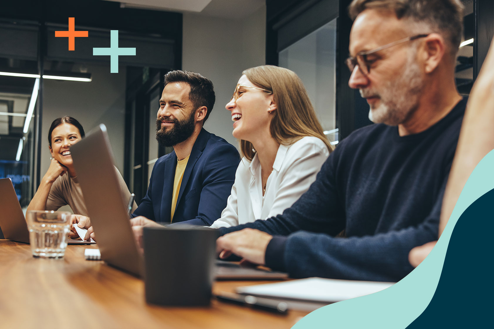 Multi-generational group of professionals working happily together